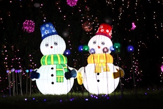 a couple of snowmen standing next to each other