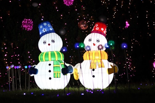 a couple of snowmen standing next to each other
