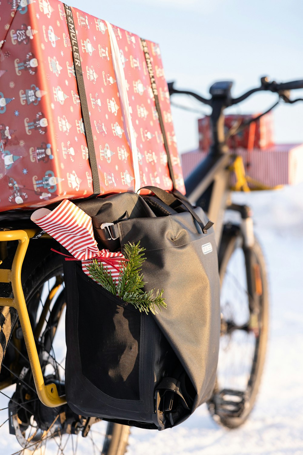 a bicycle with presents on the back of it