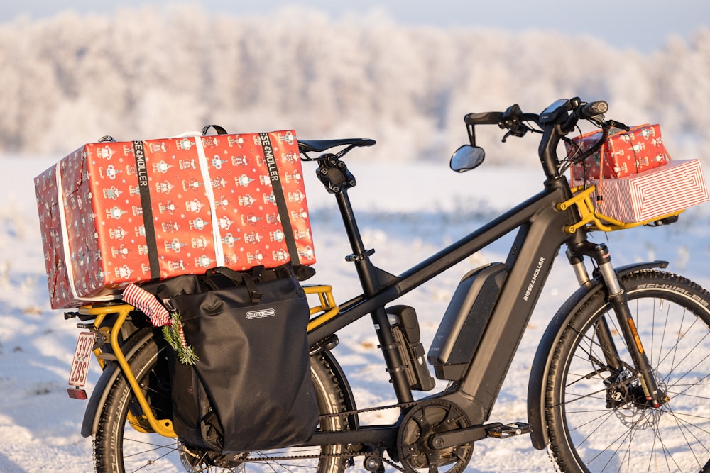 a bicycle with a bunch of presents on the back of it