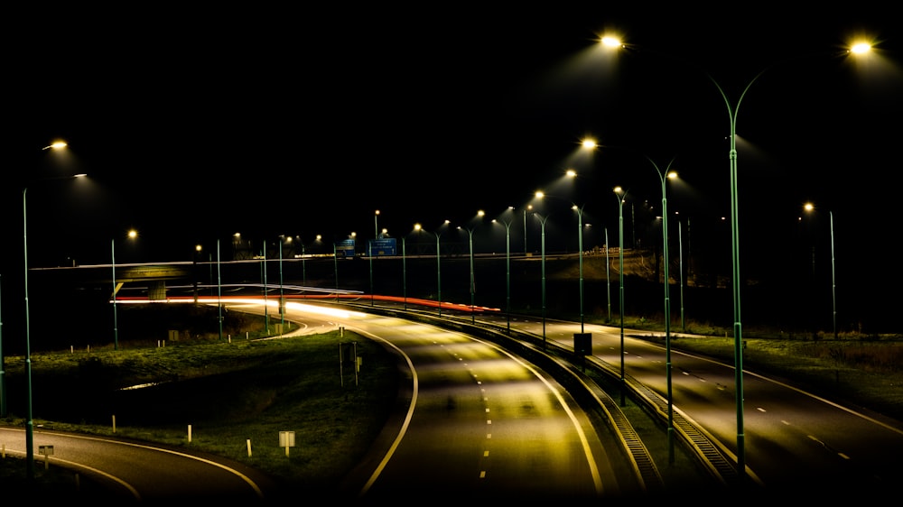 a night time view of a street with lights