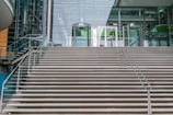 An exterior staircase leading to a contemporary building entrance.