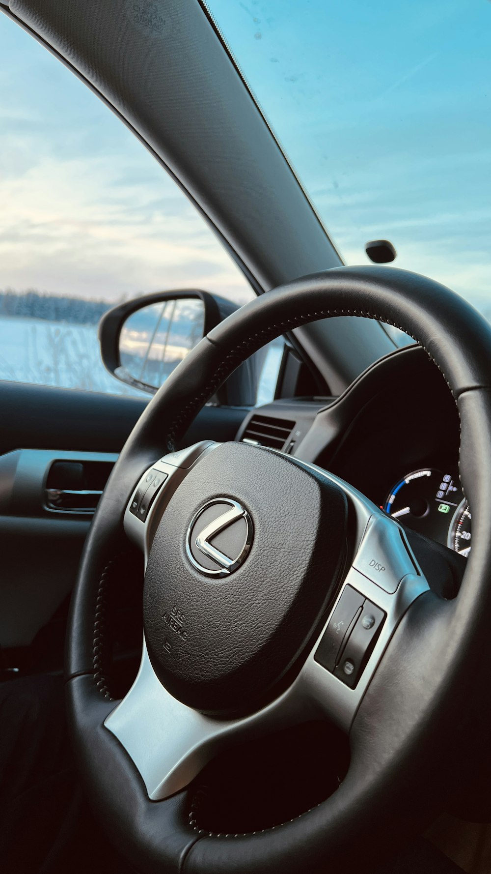 the interior of a car with a steering wheel