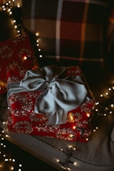 a red present box with a bow on it