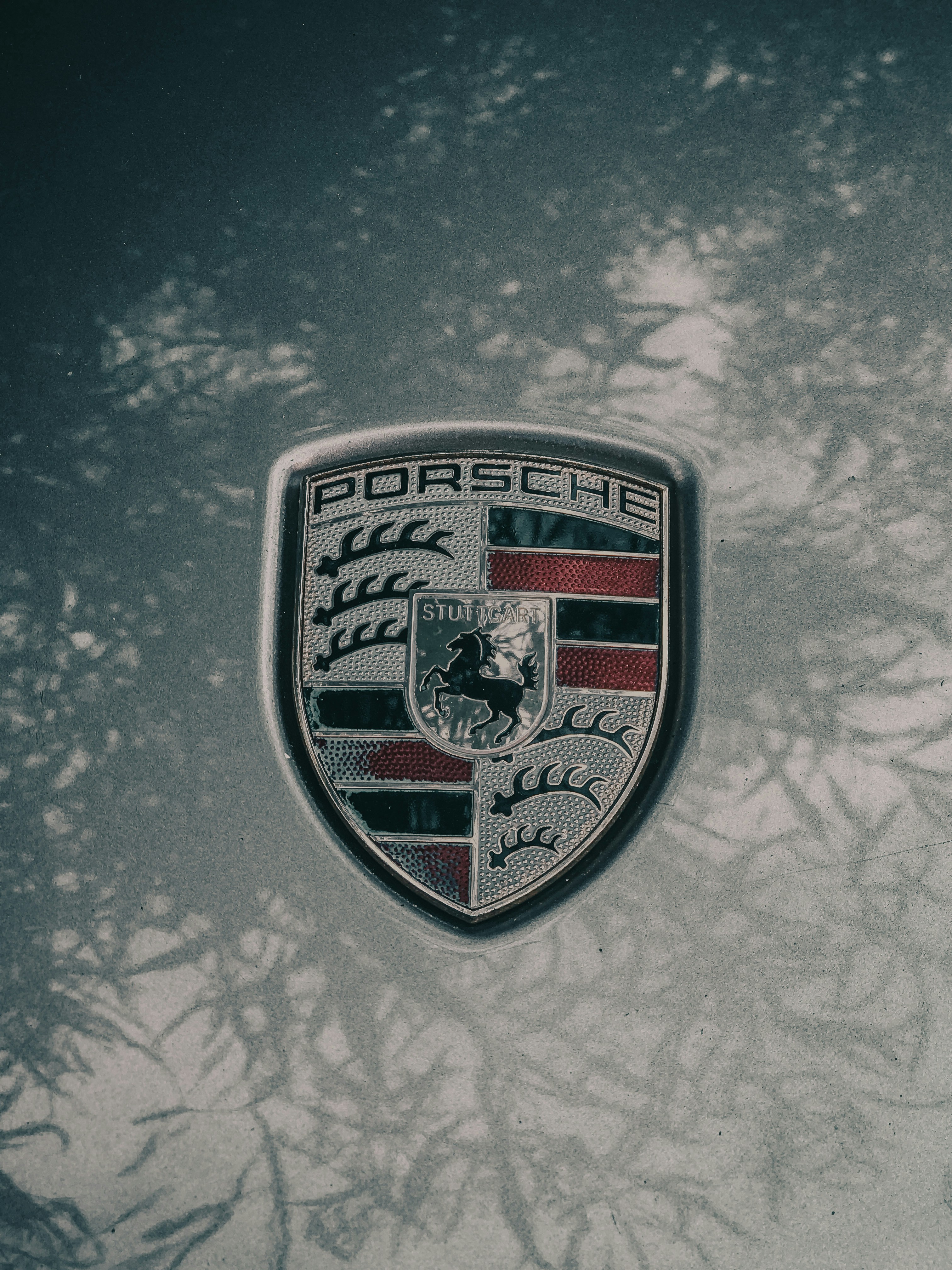 a porsche emblem is shown on a car