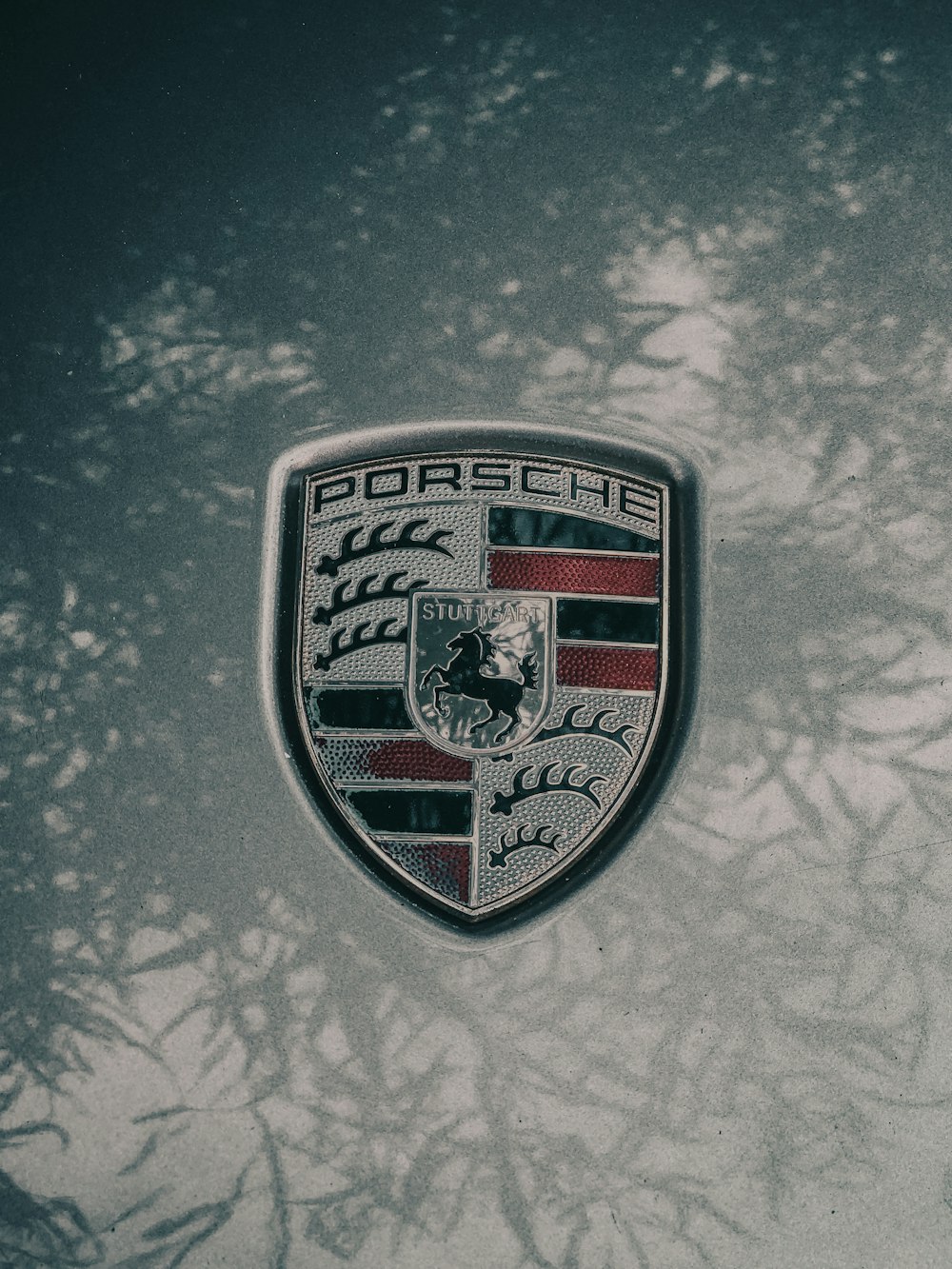 a porsche emblem is shown on a car