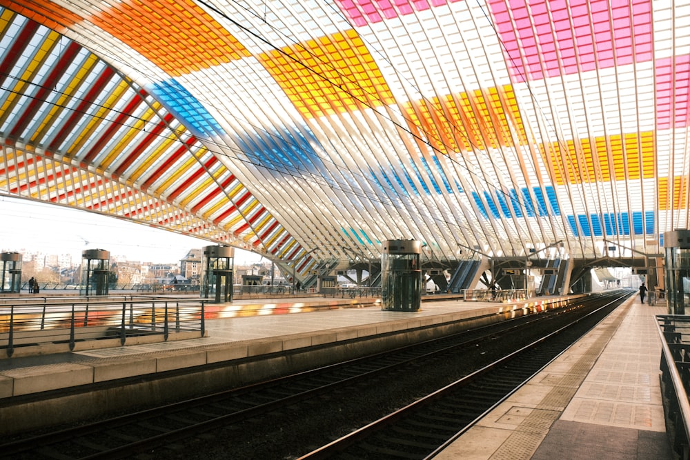 a train station with a train on the tracks