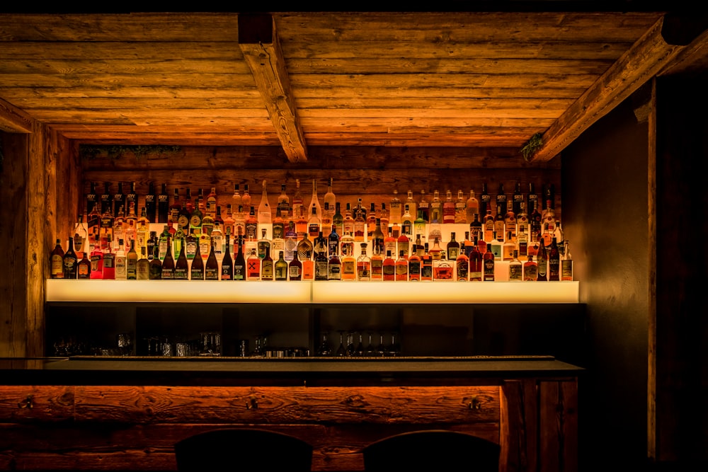 a bar with a lot of bottles behind it