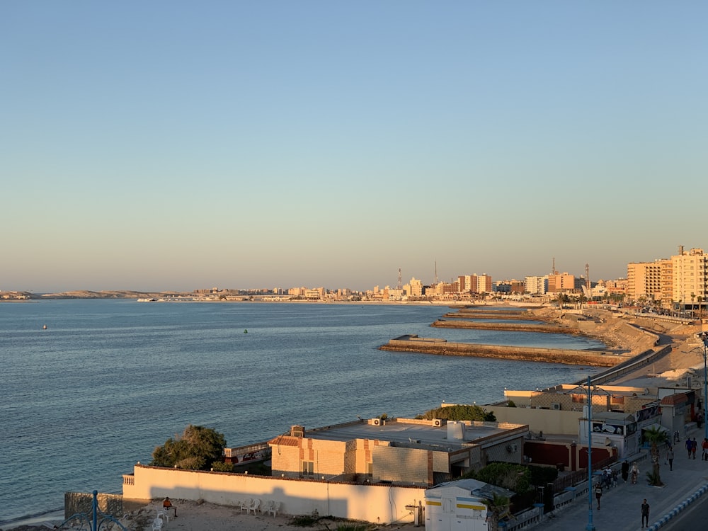 a view of a beach with a city in the background