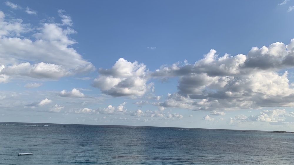 a boat floating on top of a large body of water