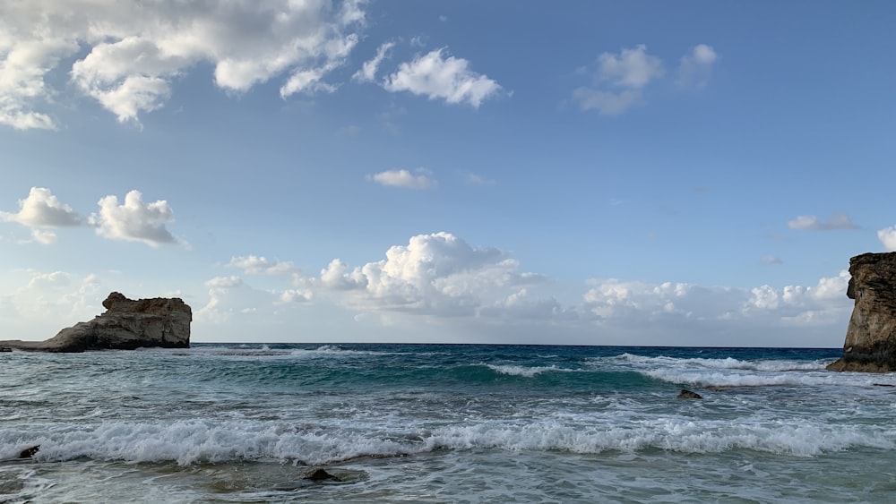 a rocky outcropping in the middle of the ocean