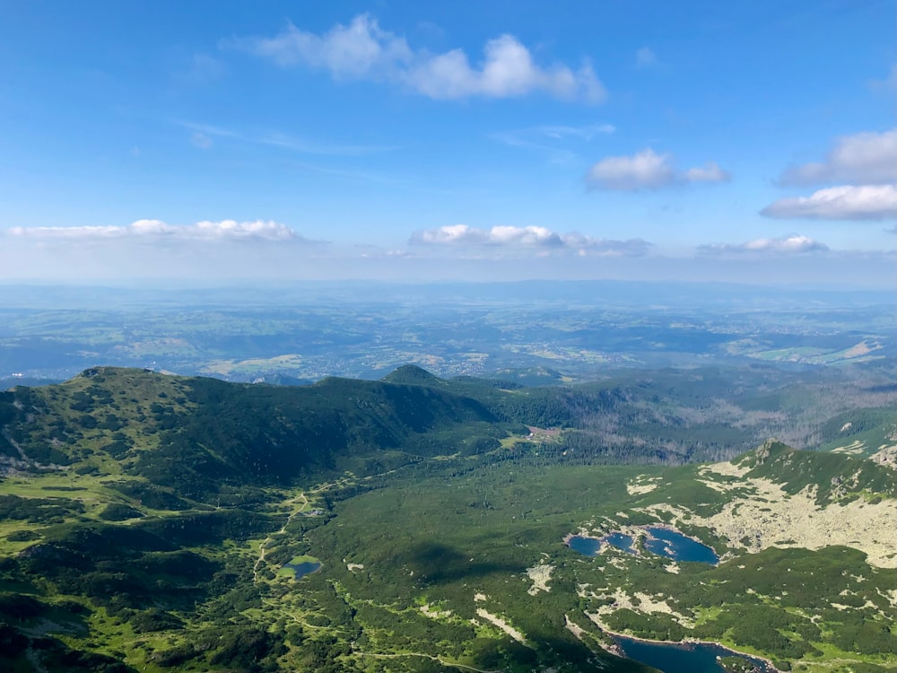 a view of a valley and mountains from a plane