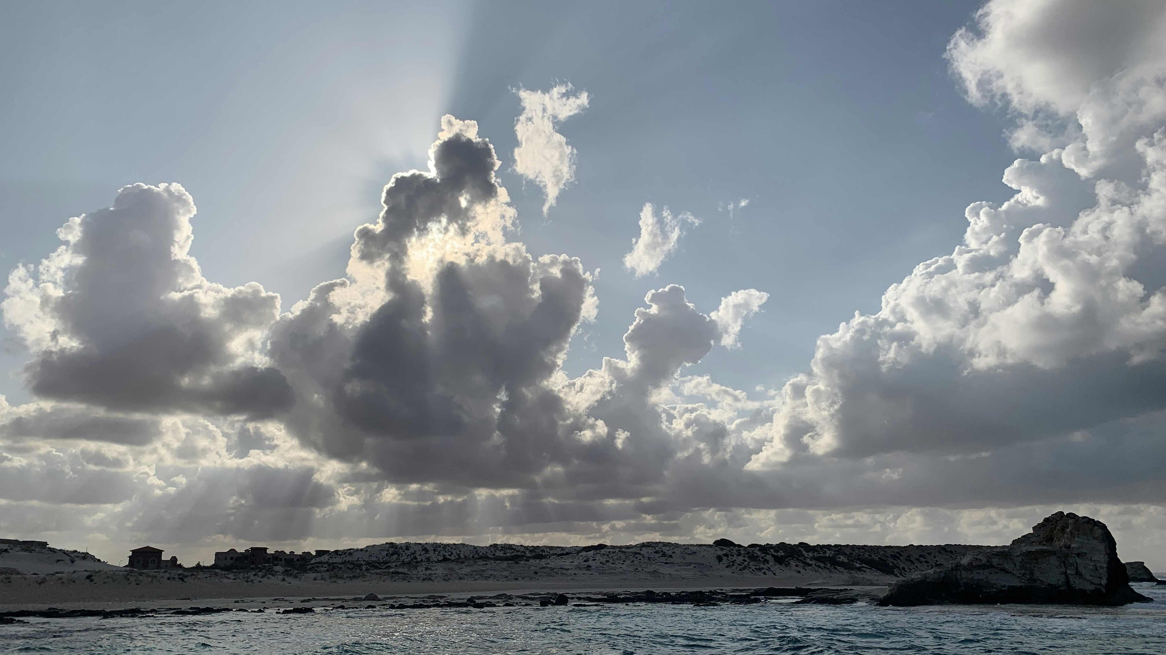The sun is shining through the clouds over the ocean photo – Free Egypt ...