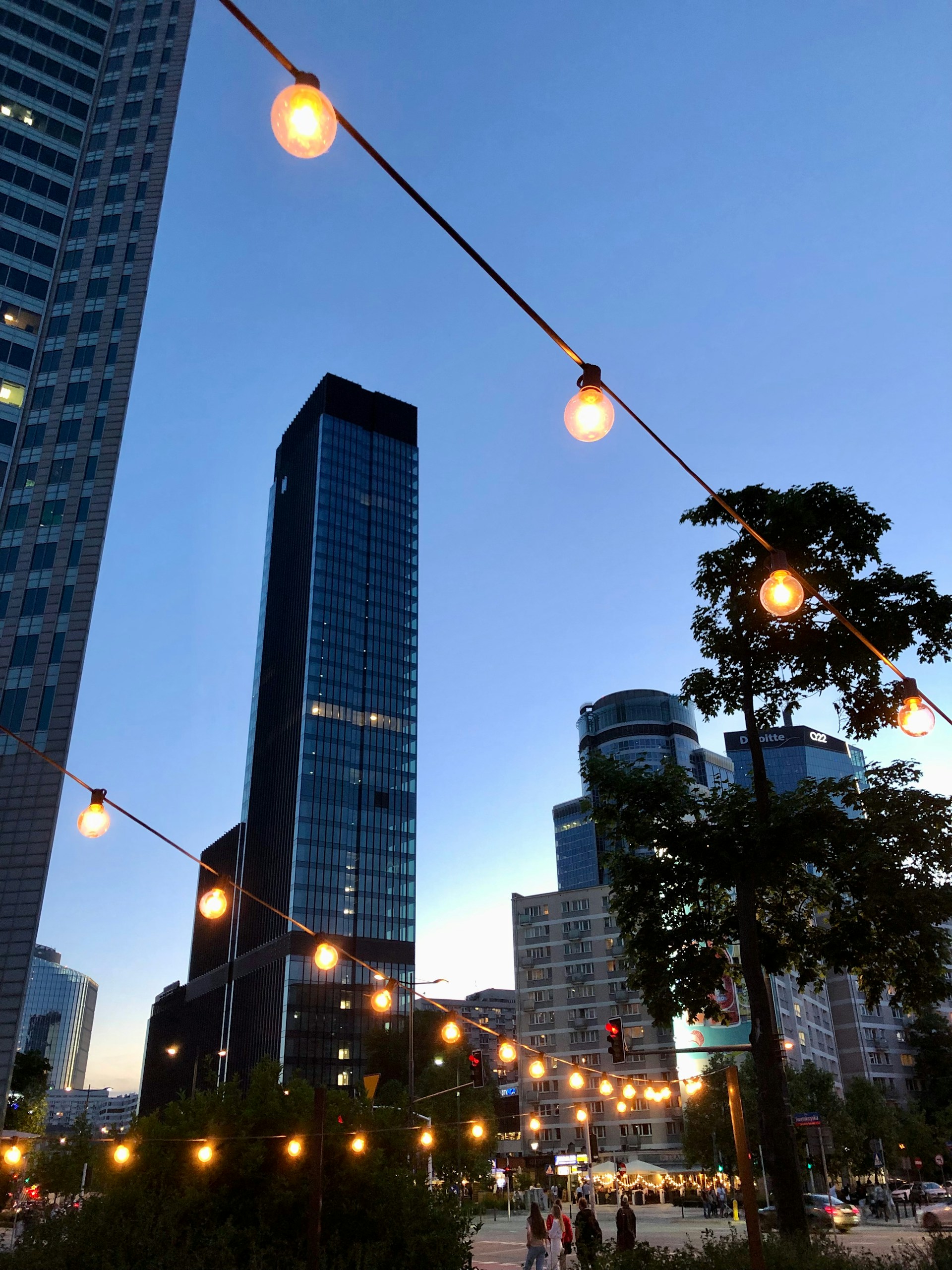 a city street filled with lots of tall buildings