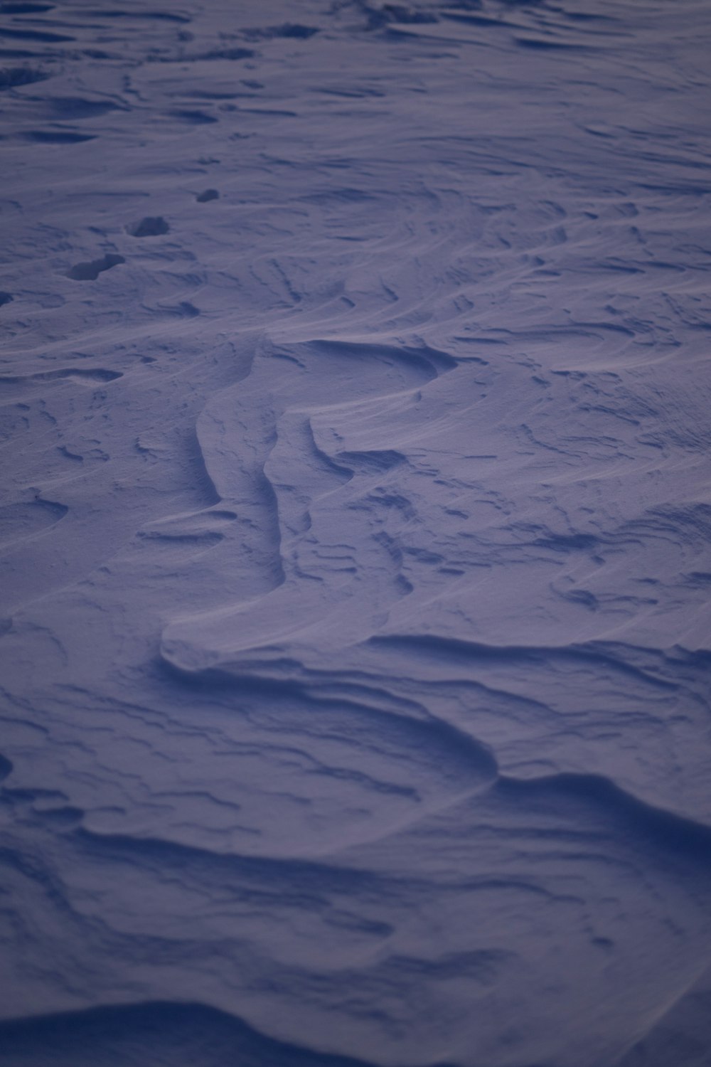 a snowboarder is going down a hill in the snow