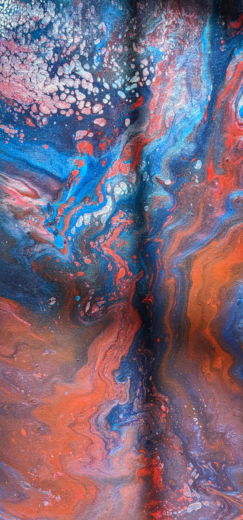 a close up of a red, blue, and black substance