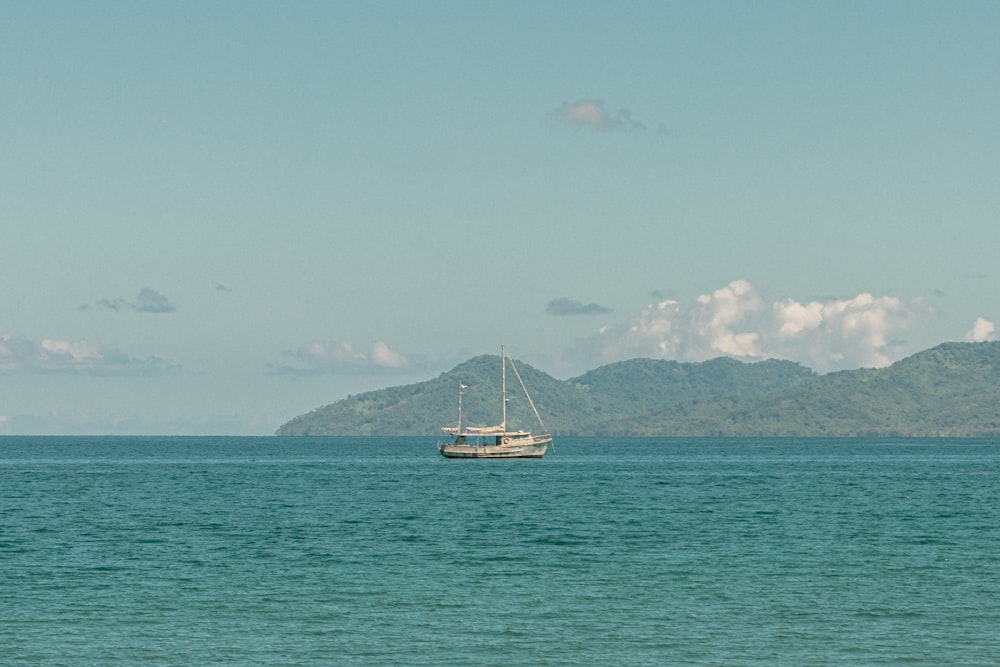 a boat floating on top of a large body of water