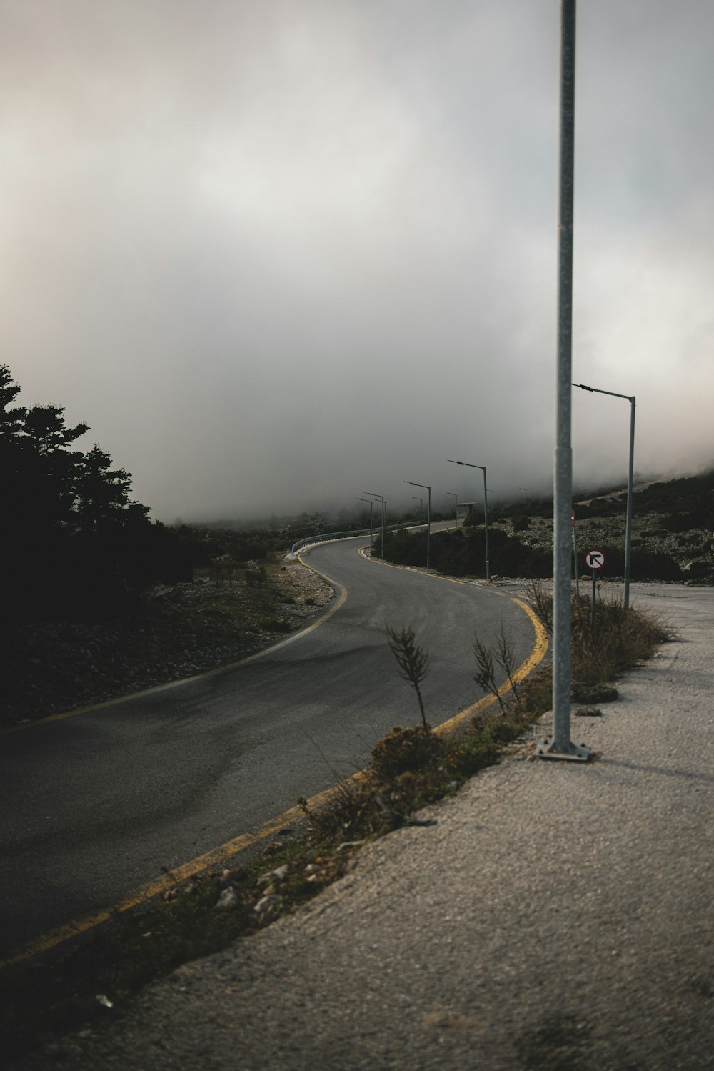 a street sign sitting on the side of a road