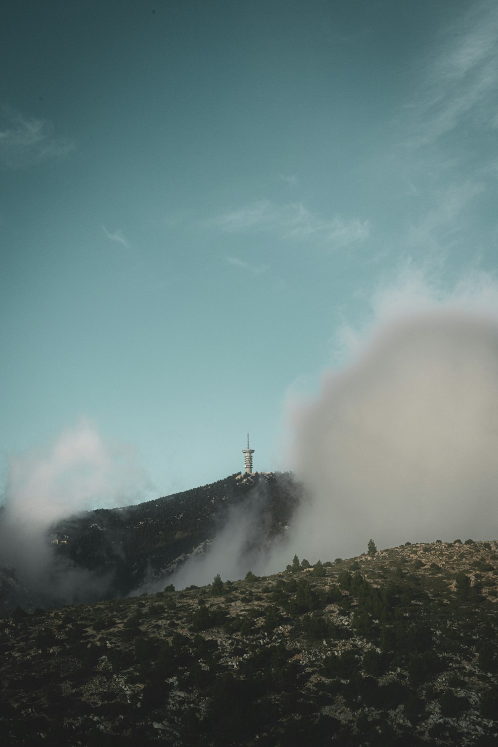 a hill with a cross on top of it