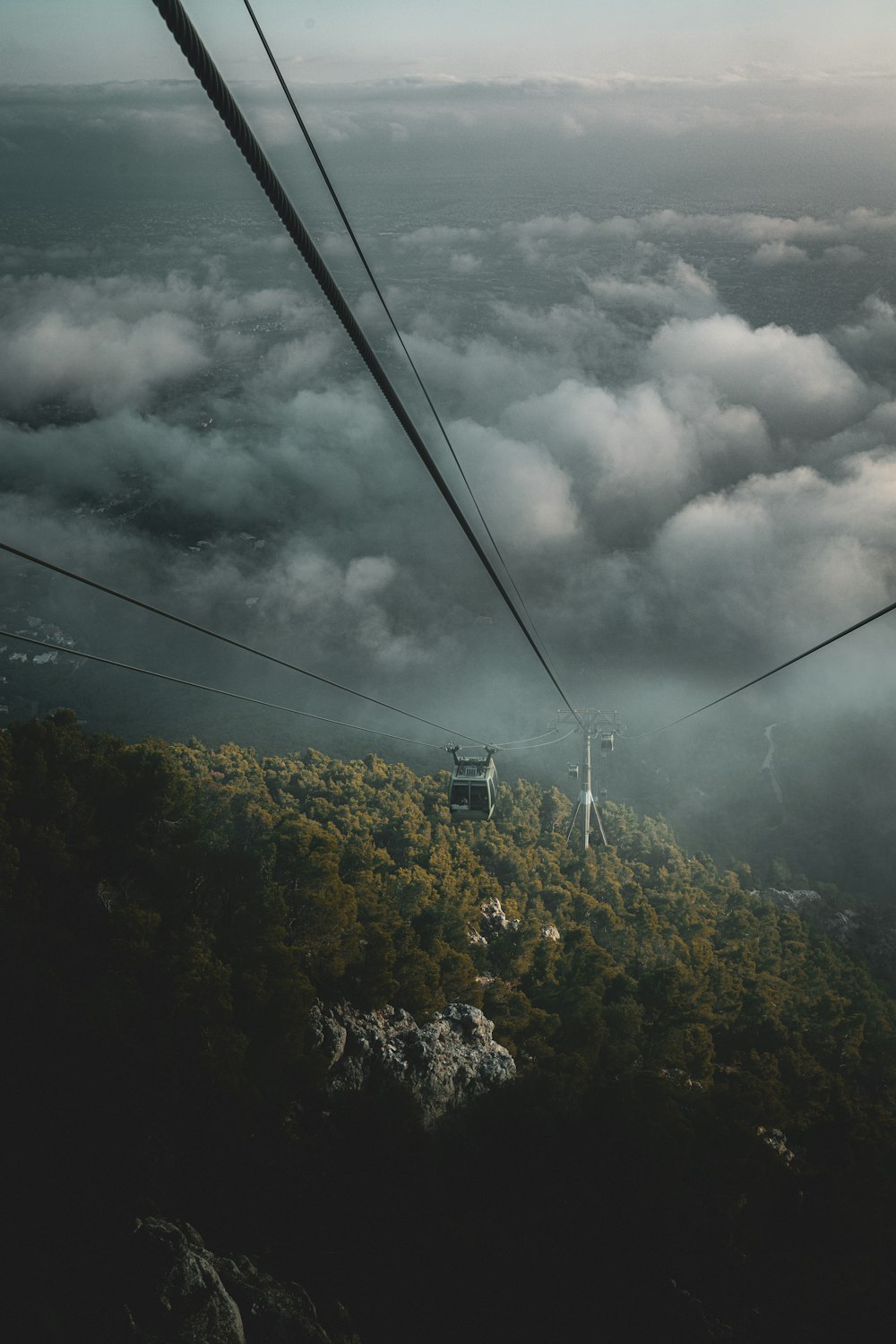 a view of the clouds from a ski lift
