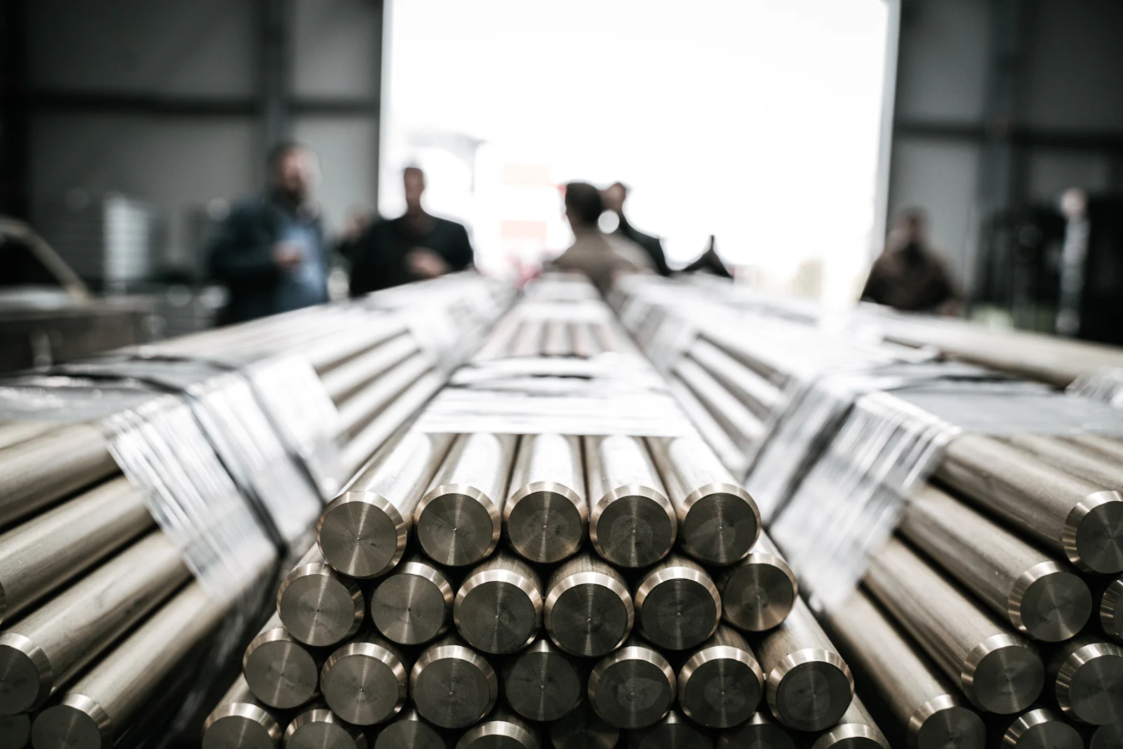 Bundles of aluminium billets and round bar stacked on the shop floor