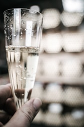 A sparkling wine flute with delicate bubbles rising.