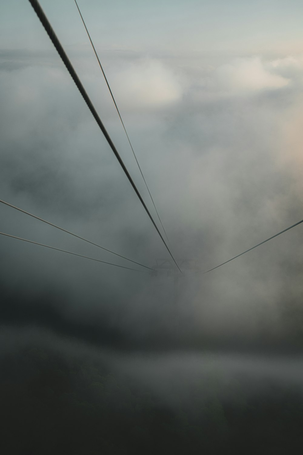 a view of a sky with clouds and power lines