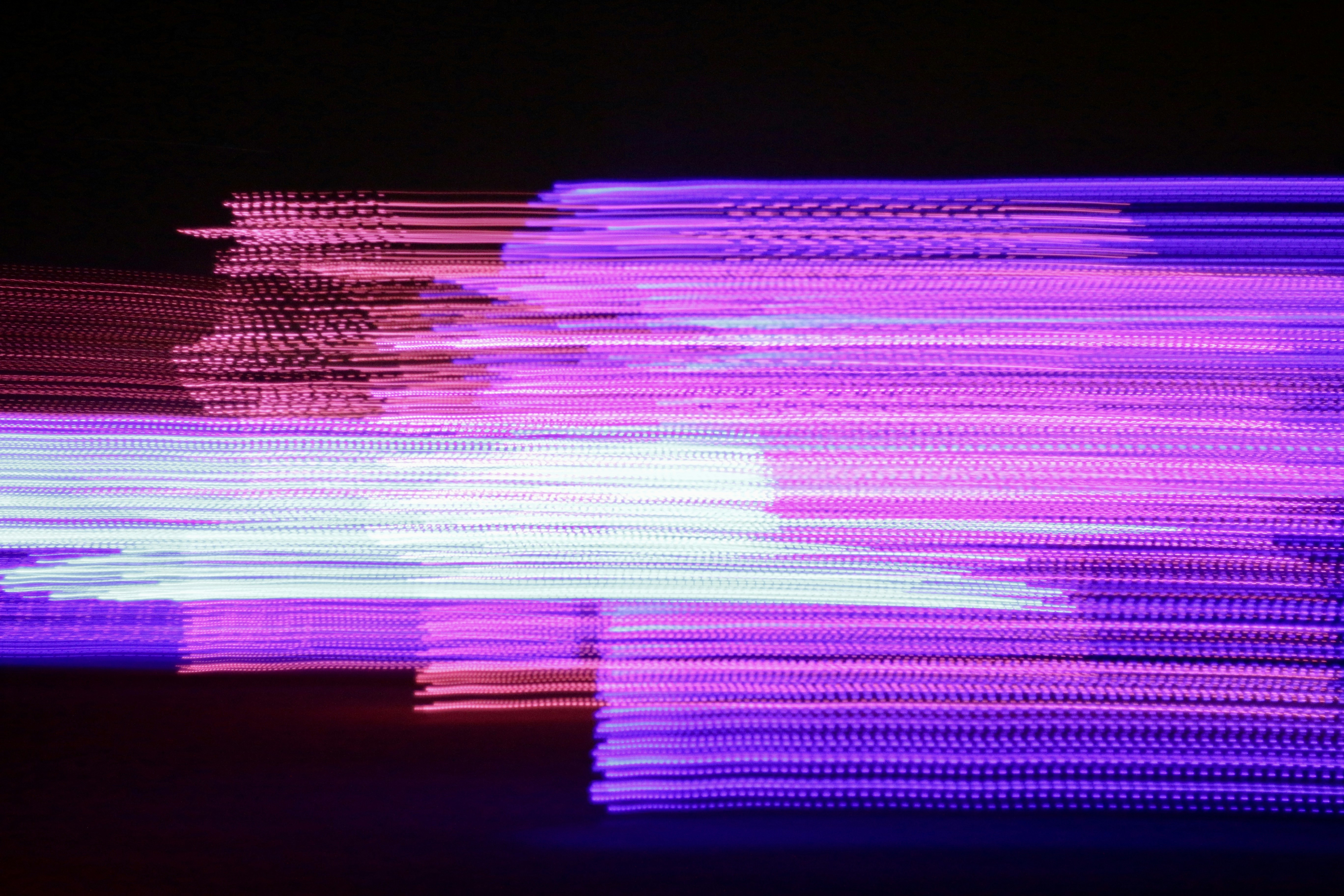 a blurry photo of purple lights in the dark