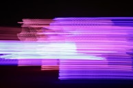 Abstract fractal textures with laser lines and glowing particles creating a futuristic vibe.