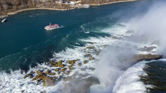 A scenic view of the Amazon river with a small boat navigating through the morning mist.