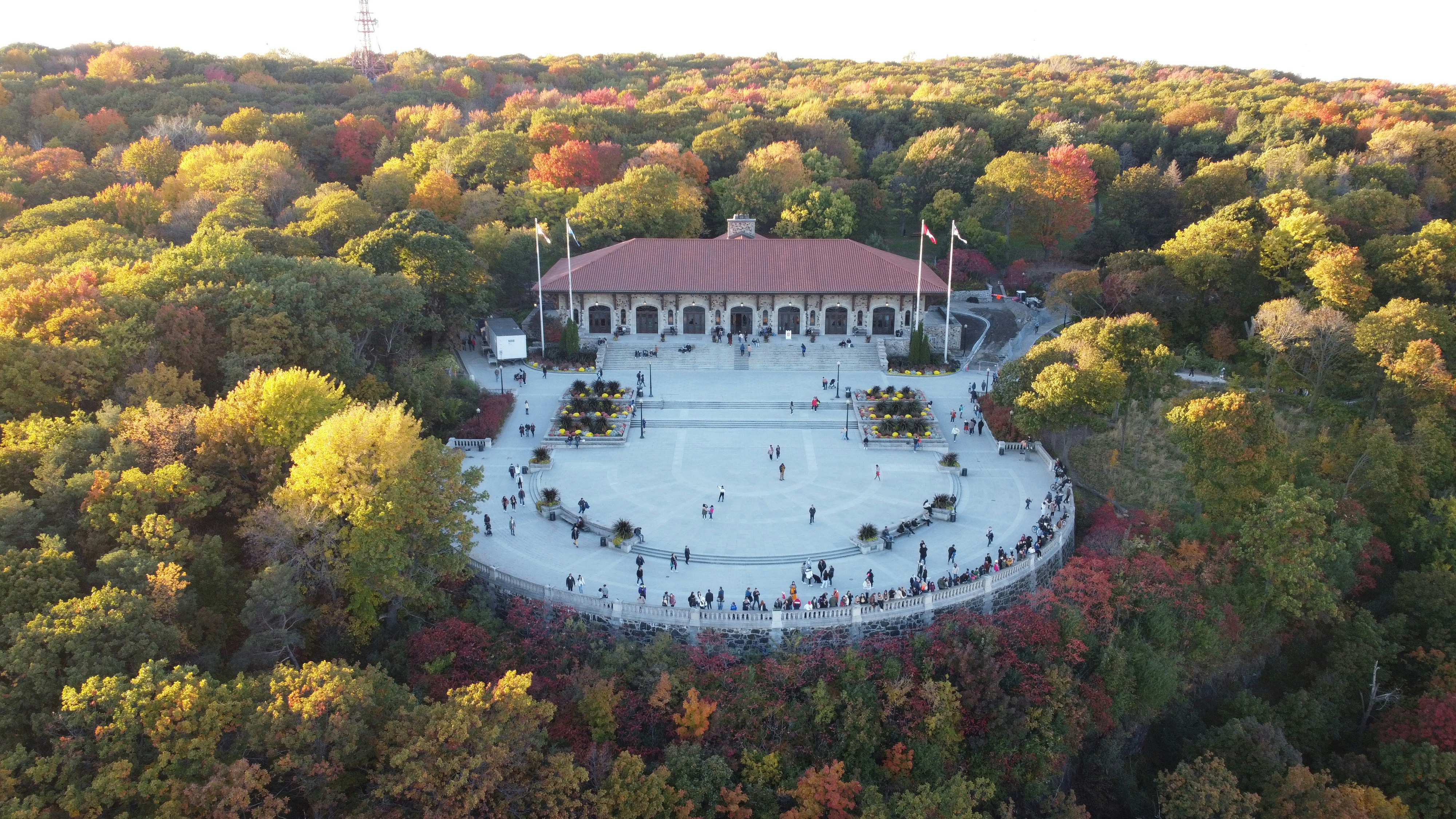 an aerial view of a building surrounded by trees