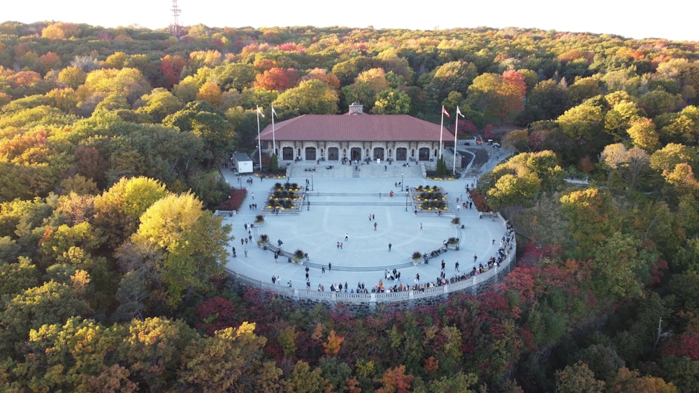 an aerial view of a building surrounded by trees