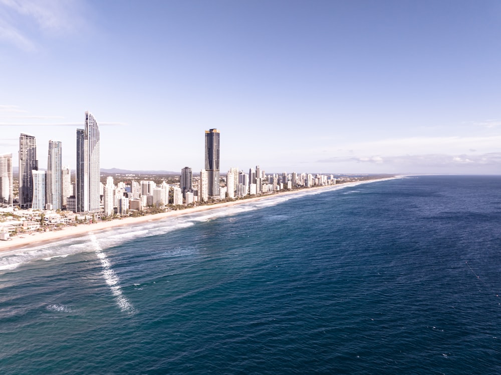 an aerial view of a city and the ocean