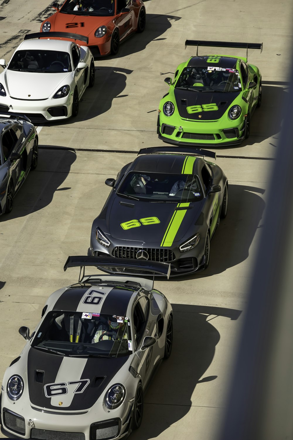 a group of racing cars lined up on a track