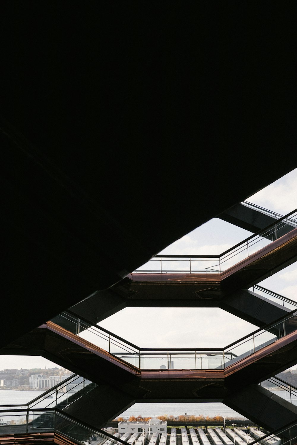 a group of people walking across a bridge