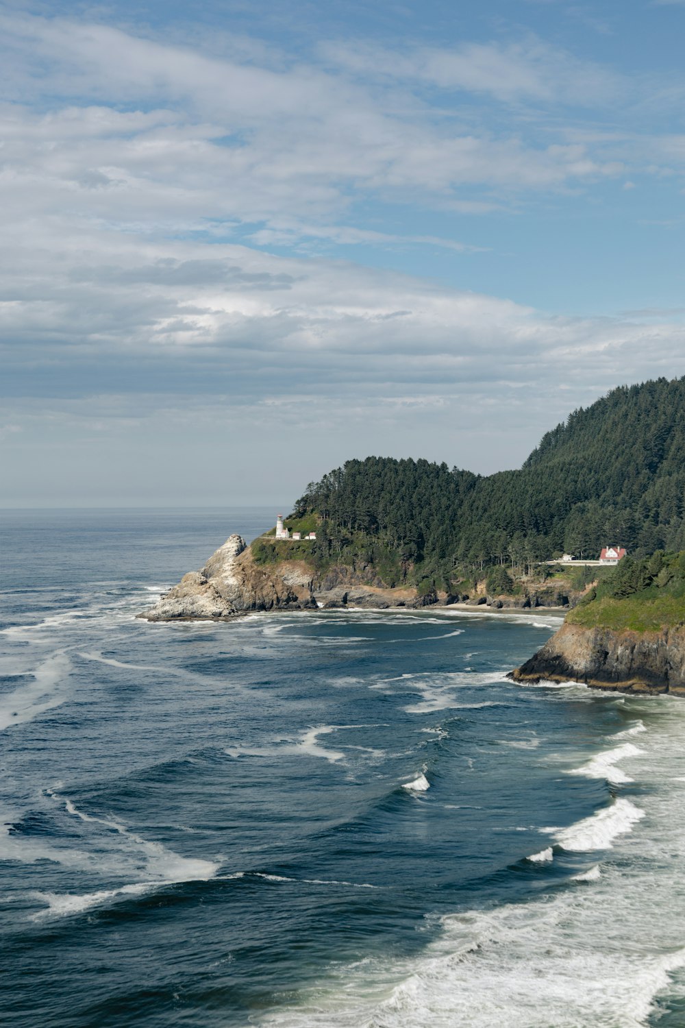 a view of the ocean with a small island in the distance