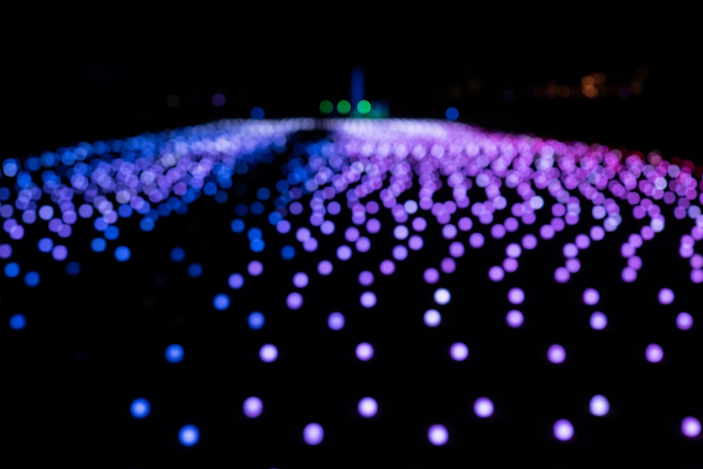 a black background with blue and purple lights