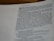 A close-up view of a page from a Bible, focusing on Isaiah 7:1. The text is printed in black on a white page, with some portions in bold and larger font indicating chapter numbers and headings.