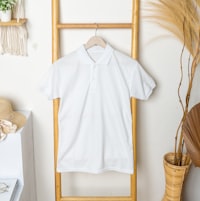 Moorland Ridge Tee — white cotton tee on a rail, photo by Mediamodifier on Unsplash