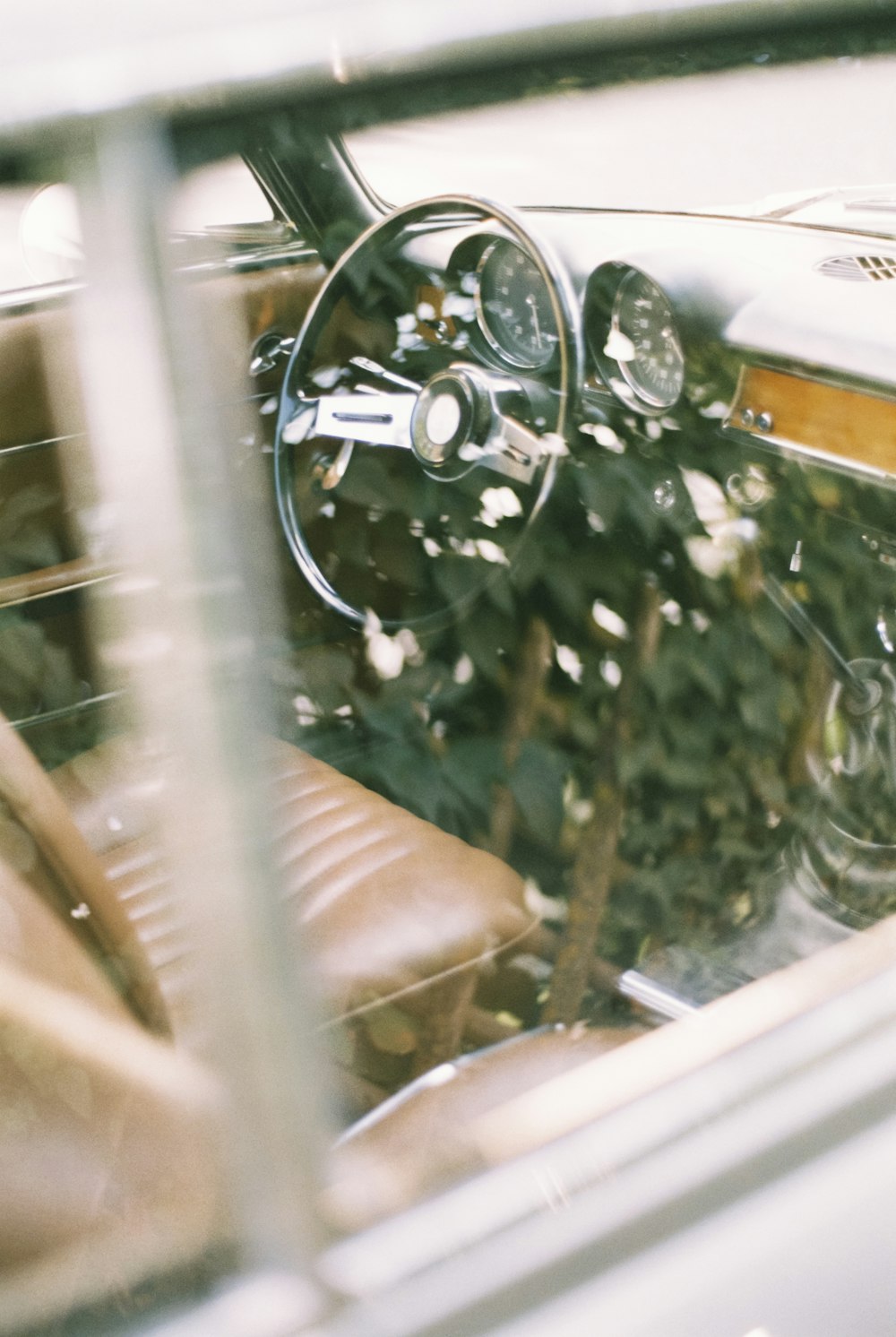 the interior of a car is shown through a window