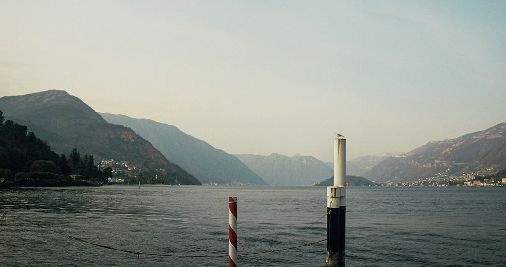 a body of water with mountains in the background