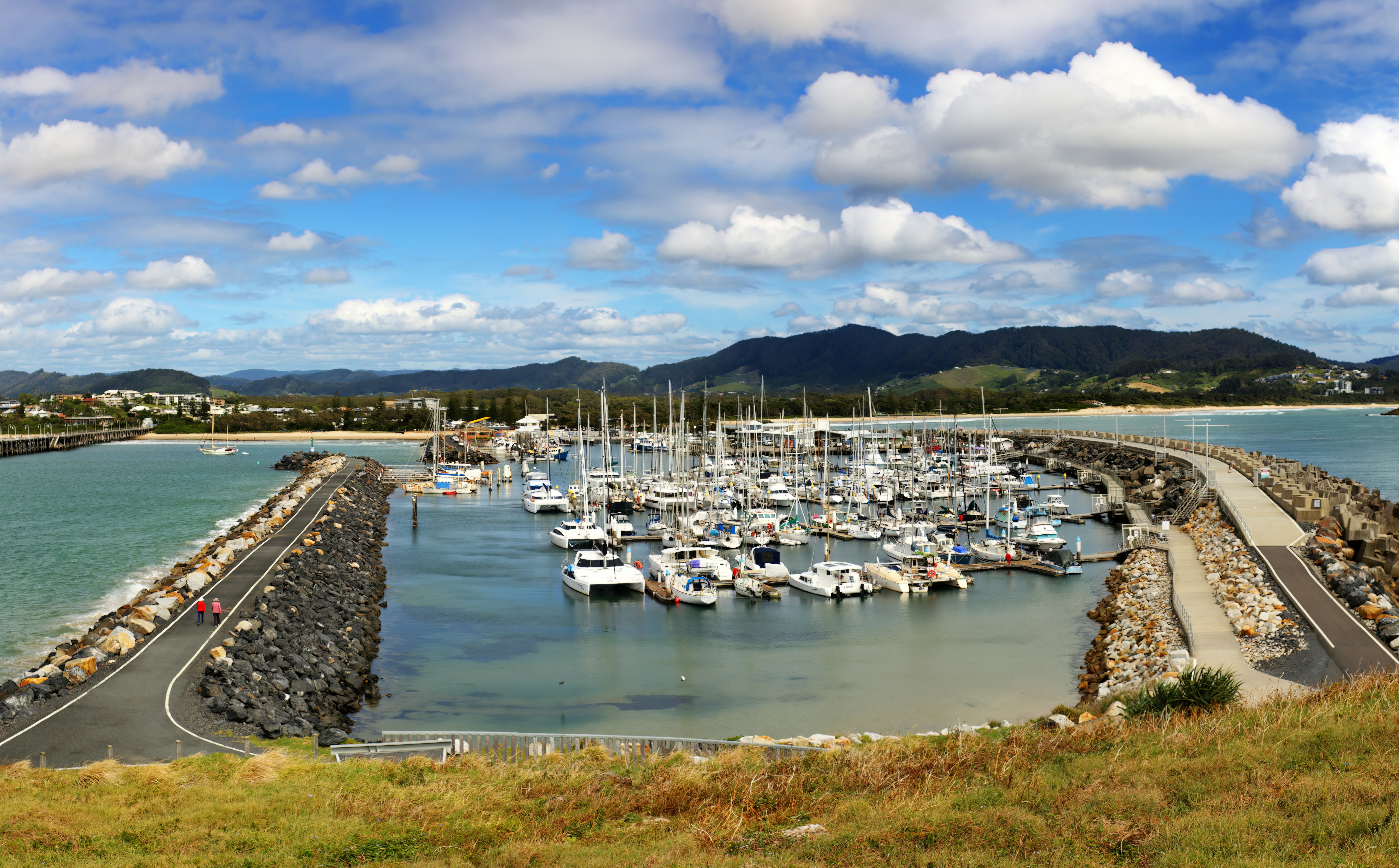 A harbor filled with lots of boats under a cloudy blue sky photo Free Coffs harbour nsw Image