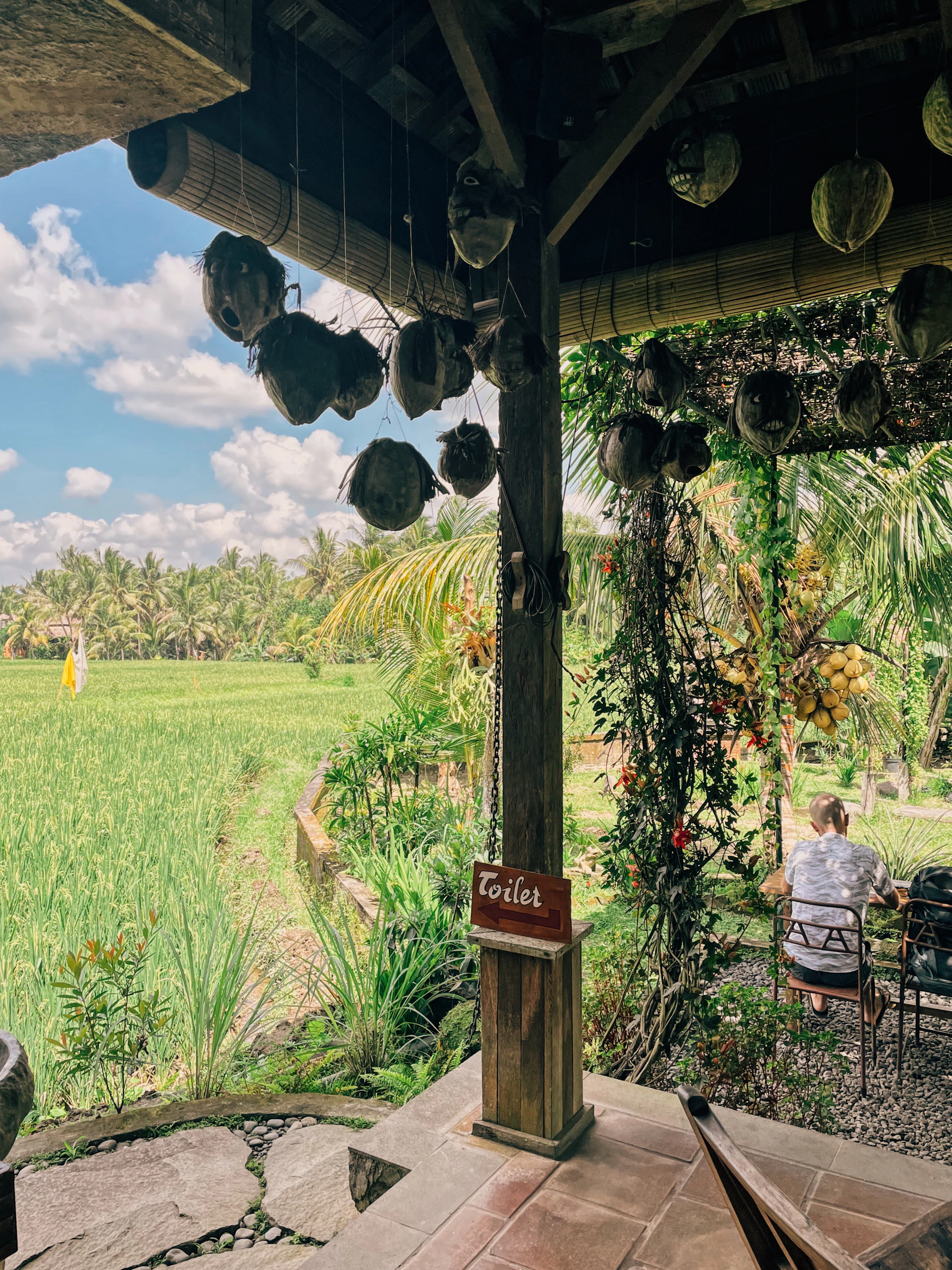 woman wearing yellow long-sleeved dress under white clouds and blue sky during daytime