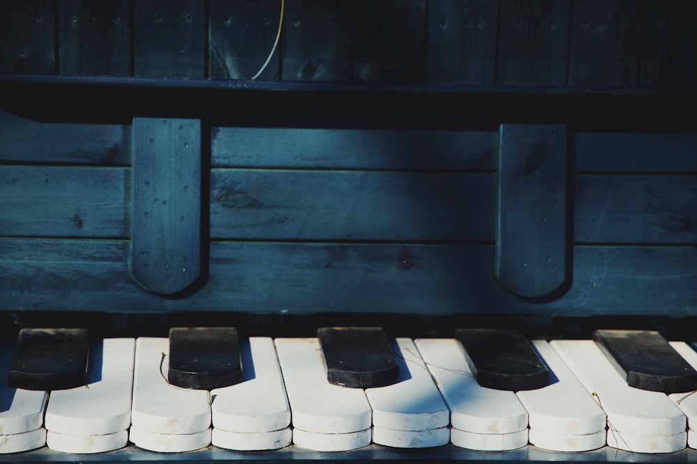 a close up of a piano with white keys