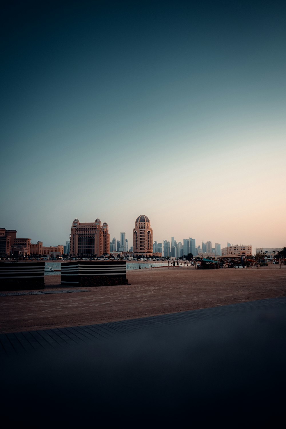 a large body of water with a city in the background