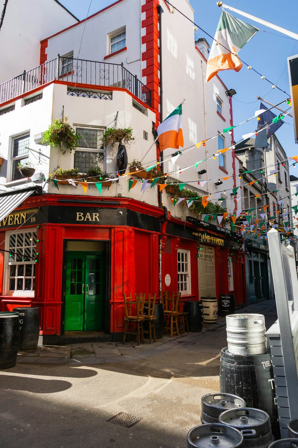 a red and white building with a green door