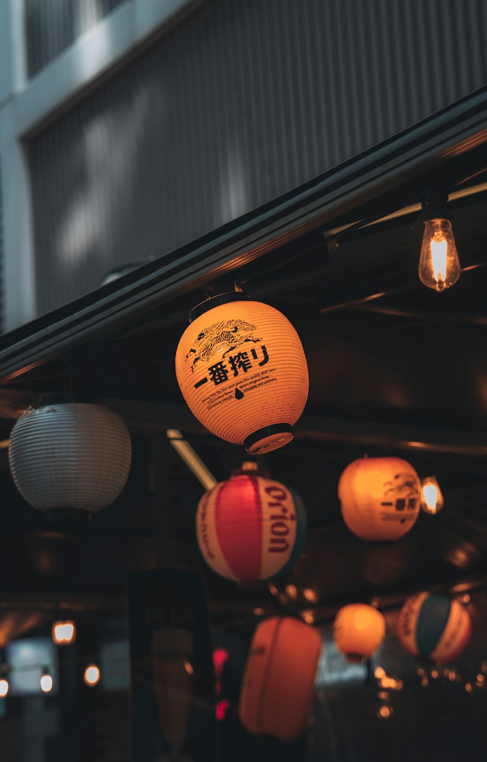 a group of lanterns hanging from a ceiling