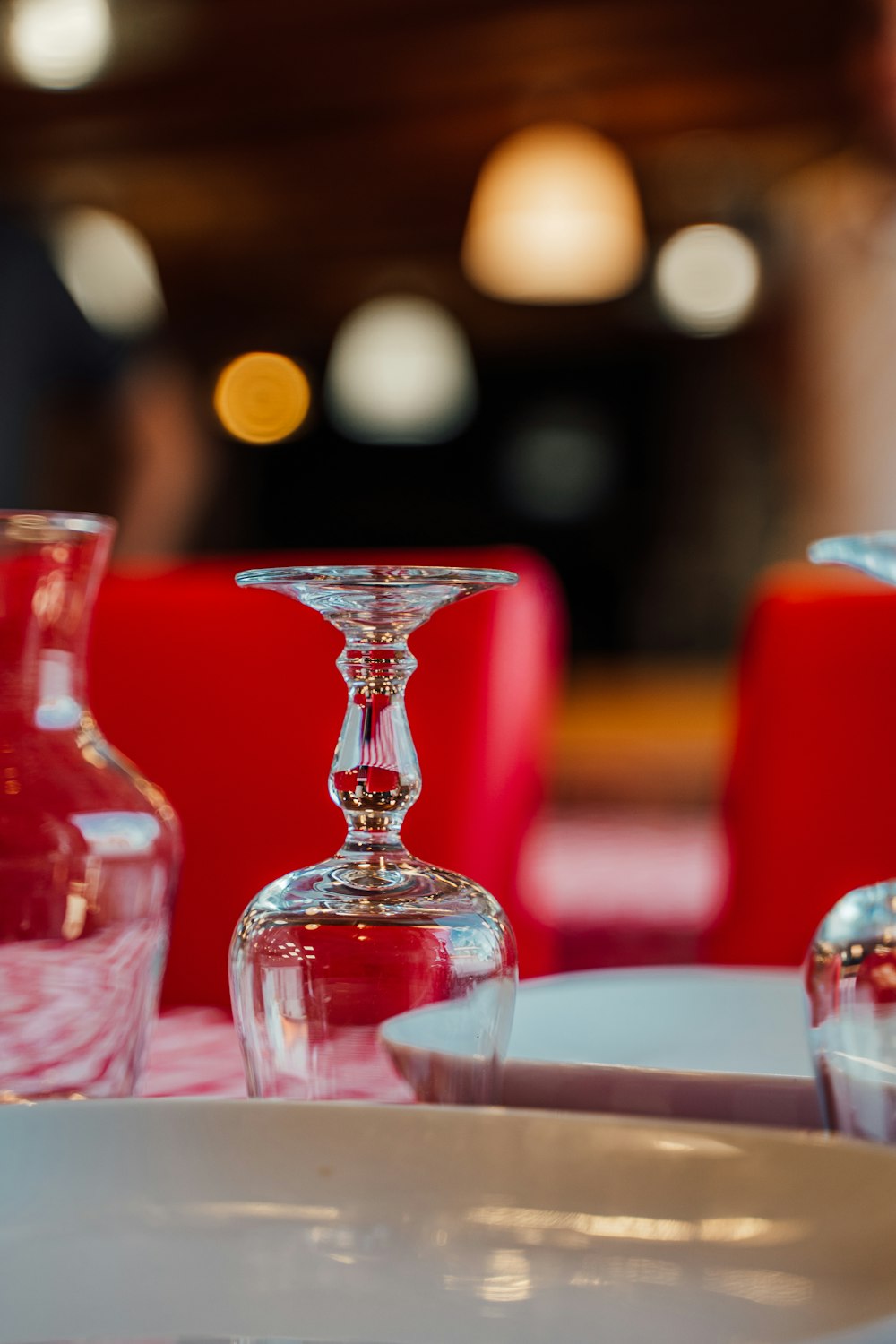 a table topped with plates and vases on top of a table