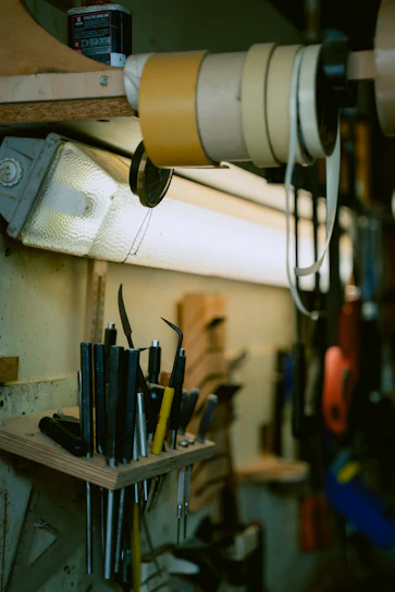 A neatly organized workbench with high-quality hand tools and power drills ready for use.