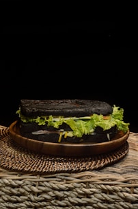 a sandwich on a plate with lettuce on it